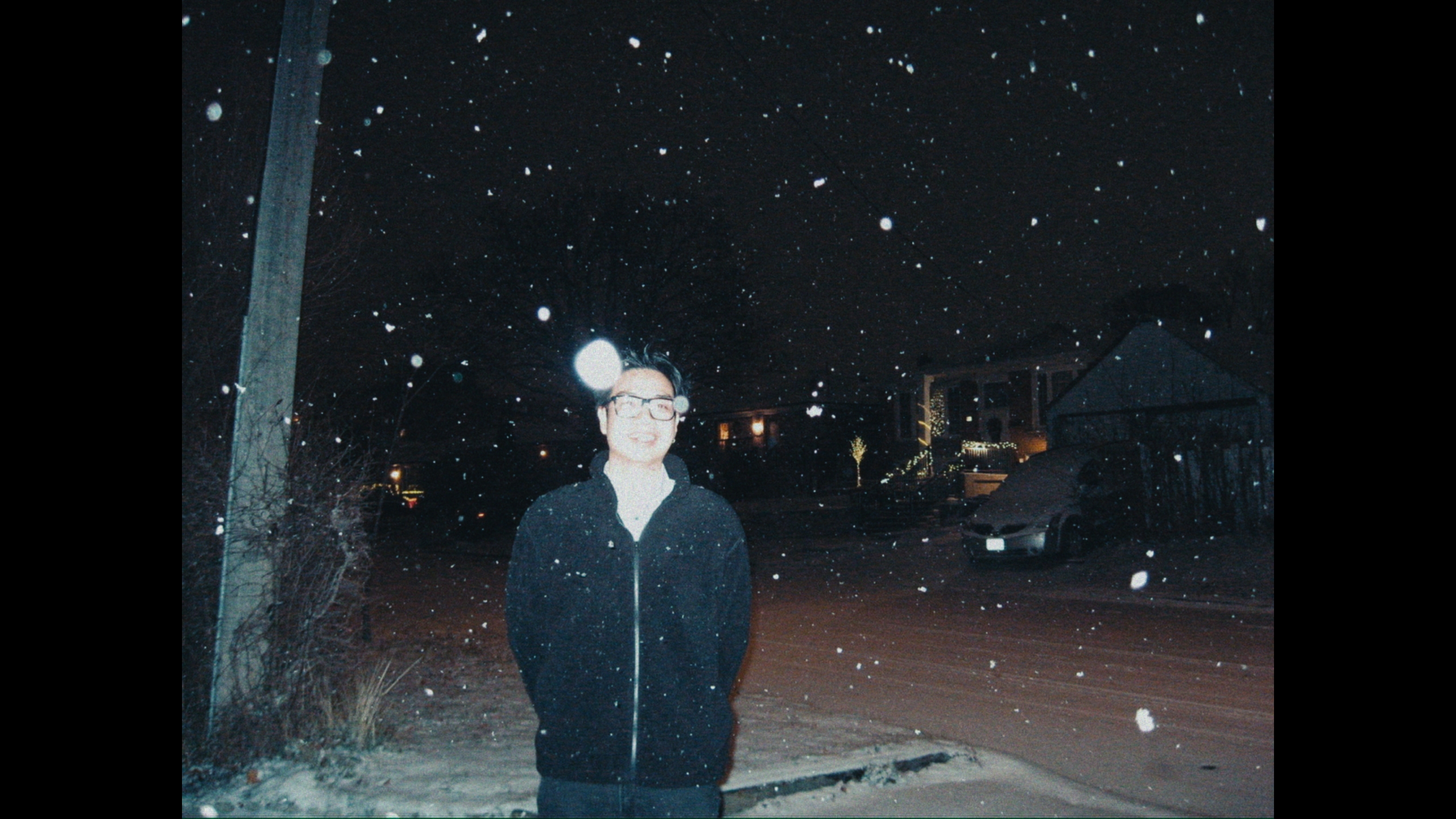 Phong Tran standing outdoors on a snowy night