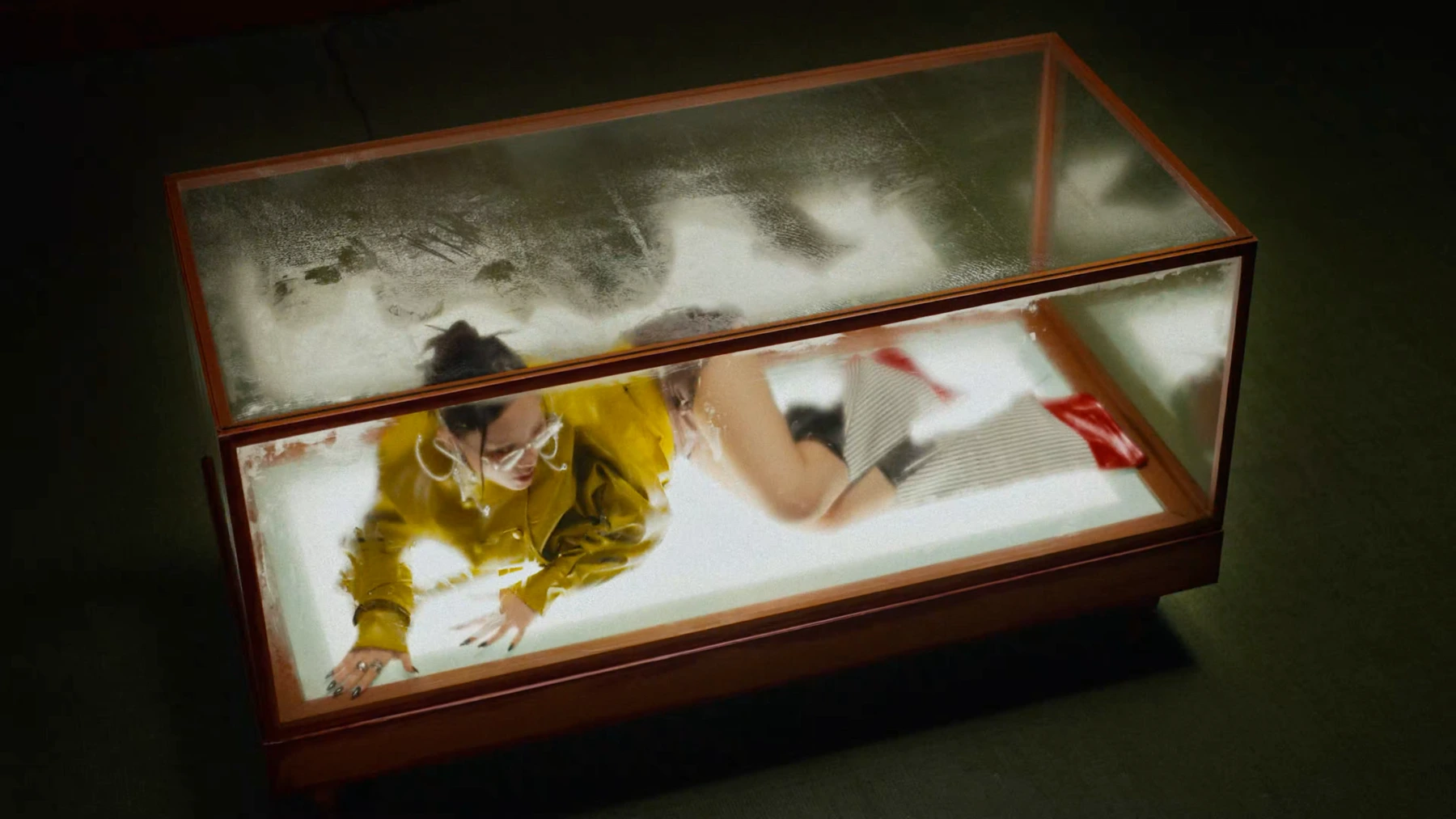 Figure in an illuminated glass box